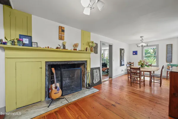 a view of a livingroom with furniture and a flat screen tv