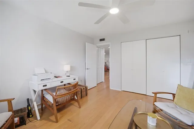 a bedroom with a bed and a workspace