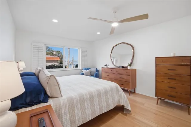 a bed room with a bed and a dresser