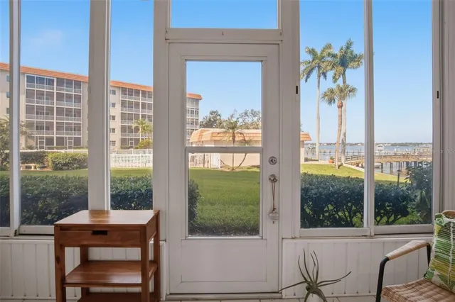 a view of a room with a table and chairs