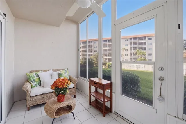 a outdoor living space with furniture and a potted plant