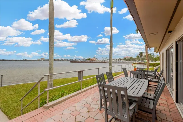 a view of a balcony with furniture