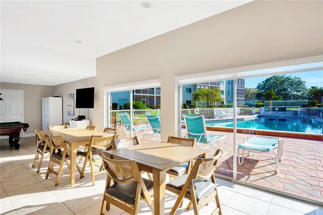 a view of a dining room with furniture window and outside view