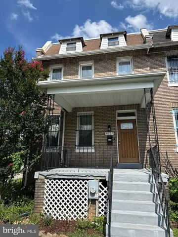 a kitchen with stainless steel appliances granite countertop a stove top oven a sink a counter space and cabinets