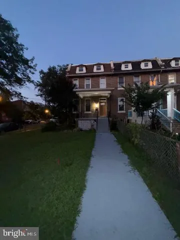 a view of house with a chairs in patio