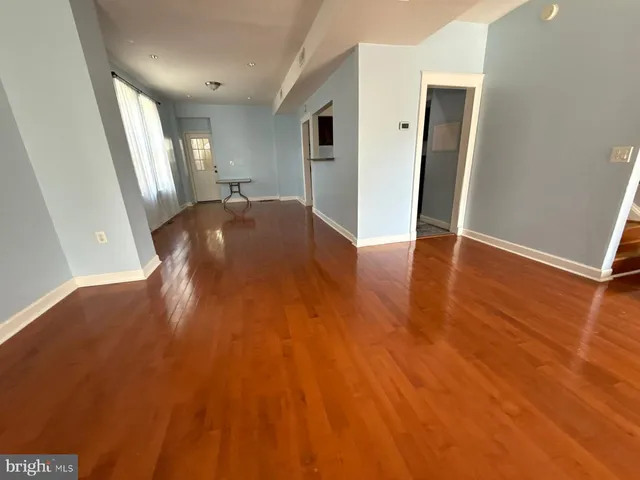 a bathroom with a sink a toilet a mirror and shower
