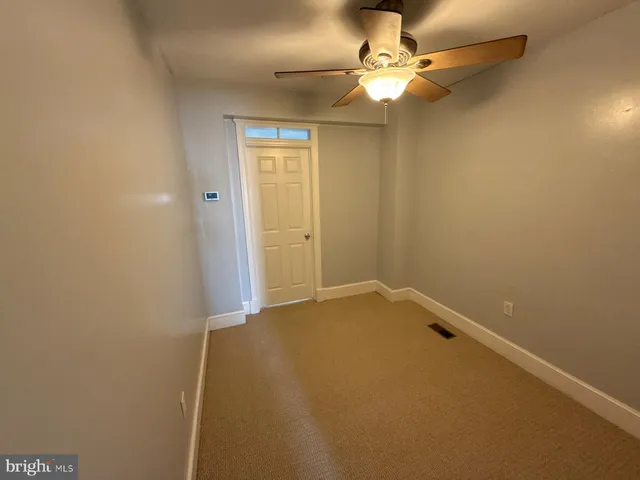 an empty room with a fireplace