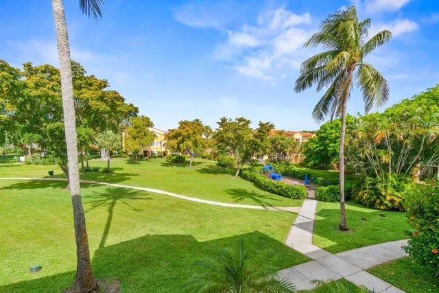 a view of a playground with basketball court
