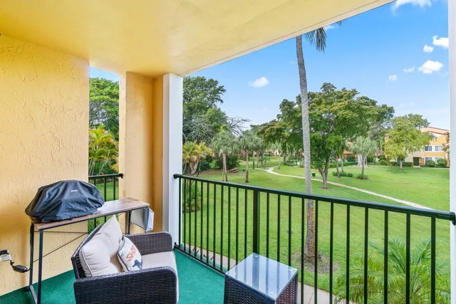 a view of balcony with furniture