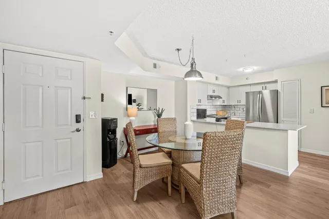 a dining room with furniture and wooden floor