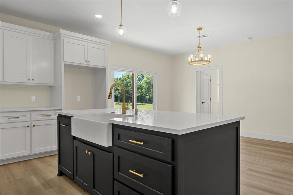 3320 North 27th Street Waco, TX 76708 - Photo 12 of 38 a kitchen with a sink cabinets and window