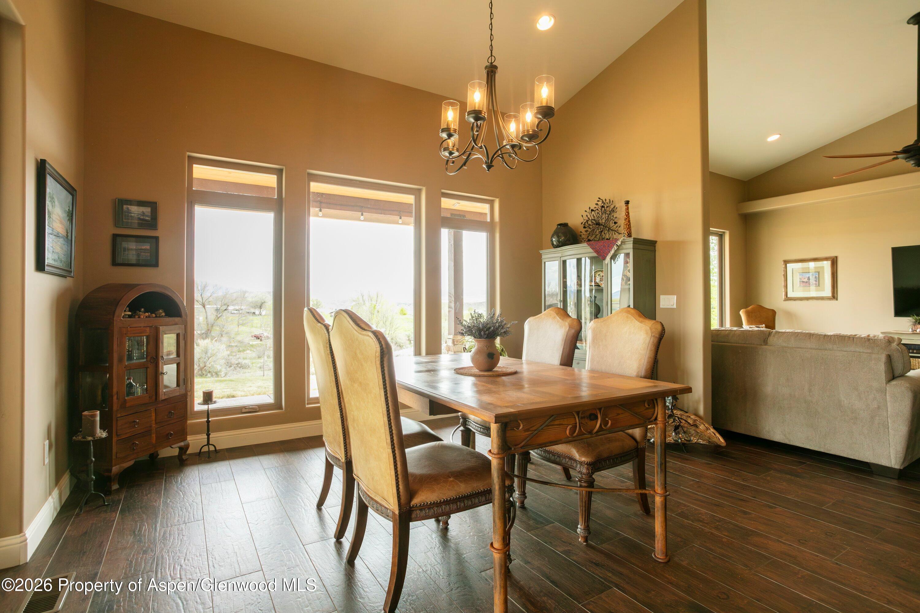265 South Meadow Drive Rifle, CO 81650 - Photo 40 of 76 a view of a dining room with furniture window and wooden floor