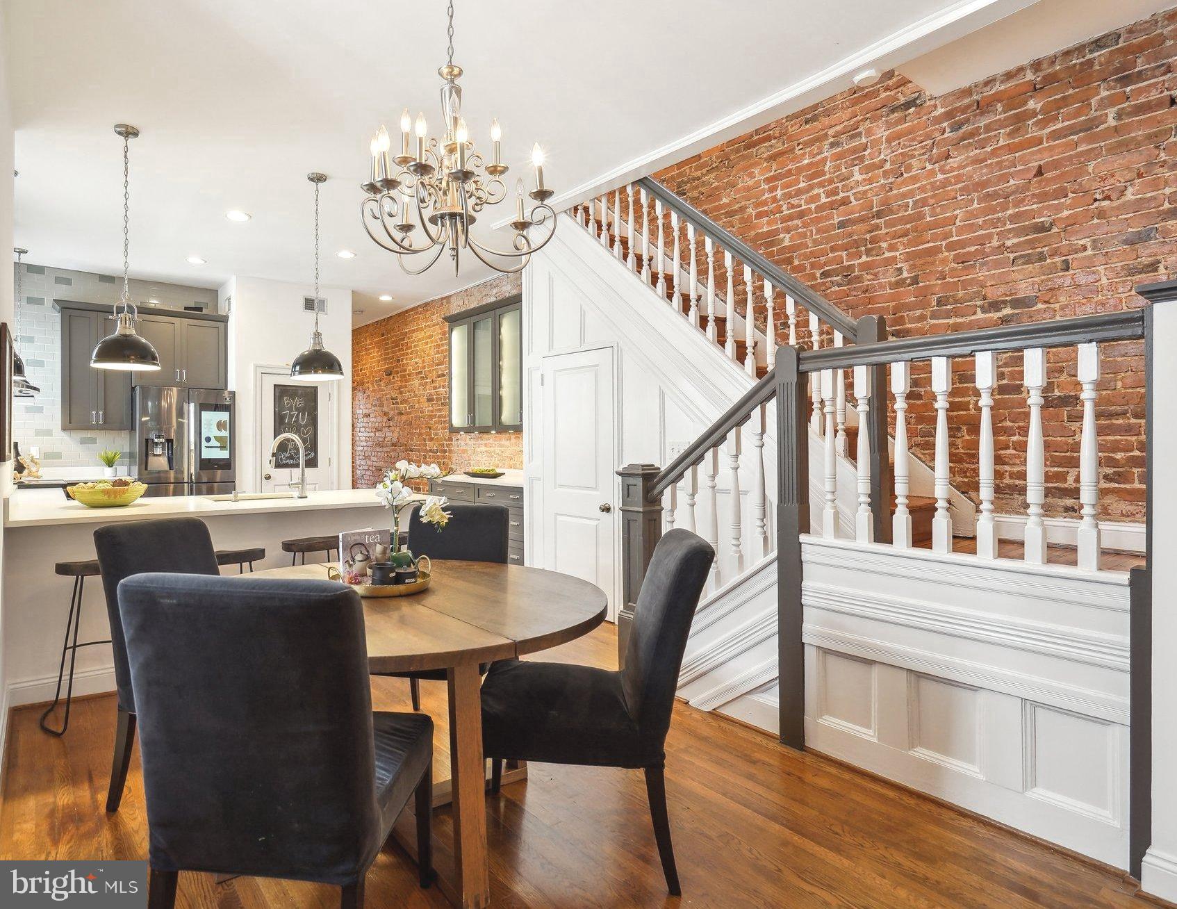 77 U Street Northwest Washington, DC 20001 - Photo 1 of 34 a view of a dining room with furniture window and wooden floor