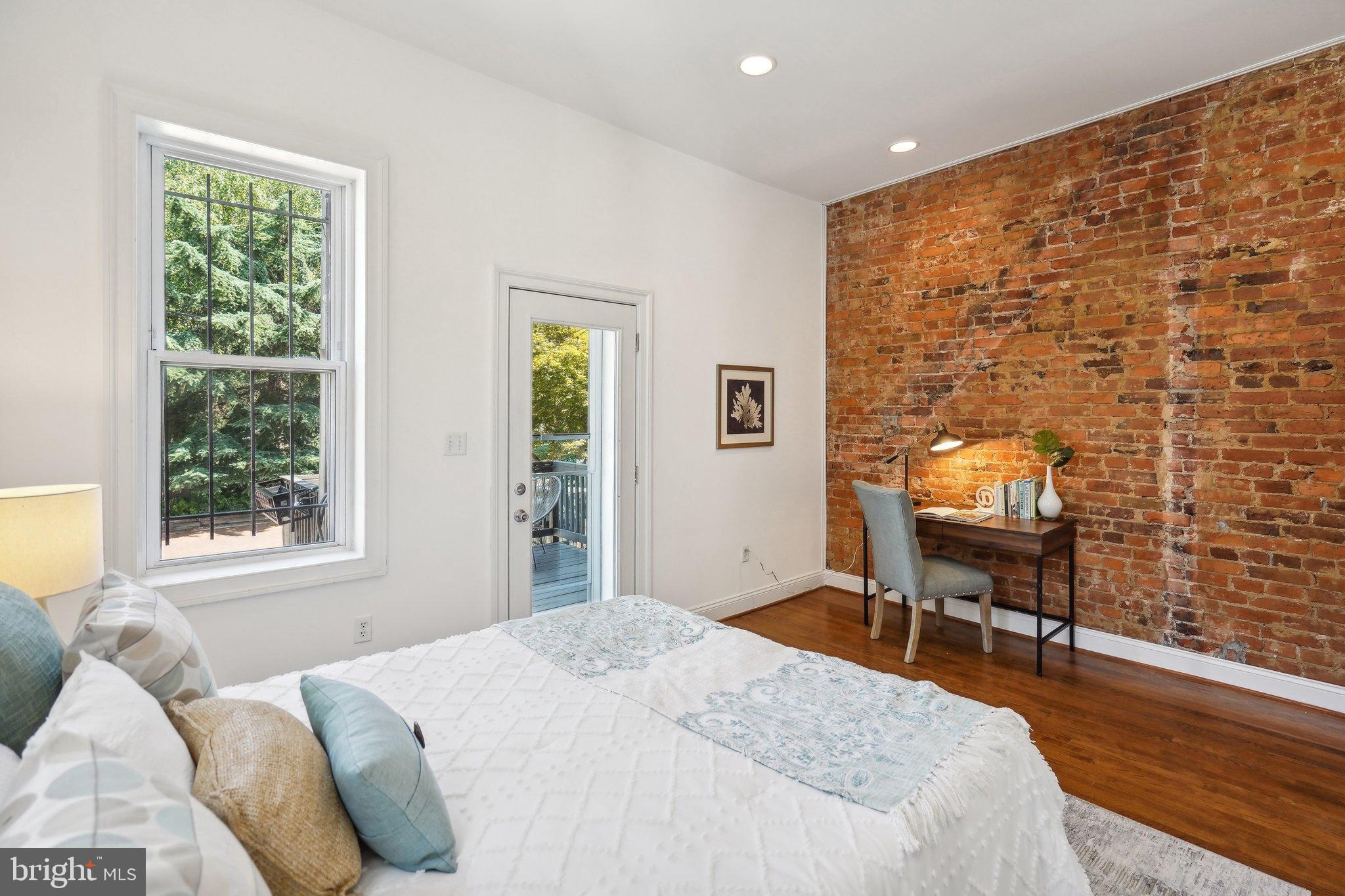 77 U Street Northwest Washington, DC 20001 - Photo 13 of 34 a bedroom with a bed and a window