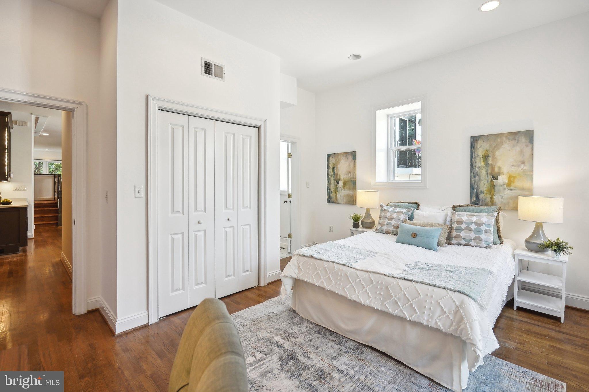 77 U Street Northwest Washington, DC 20001 - Photo 14 of 34 a bedroom with a bed and a window