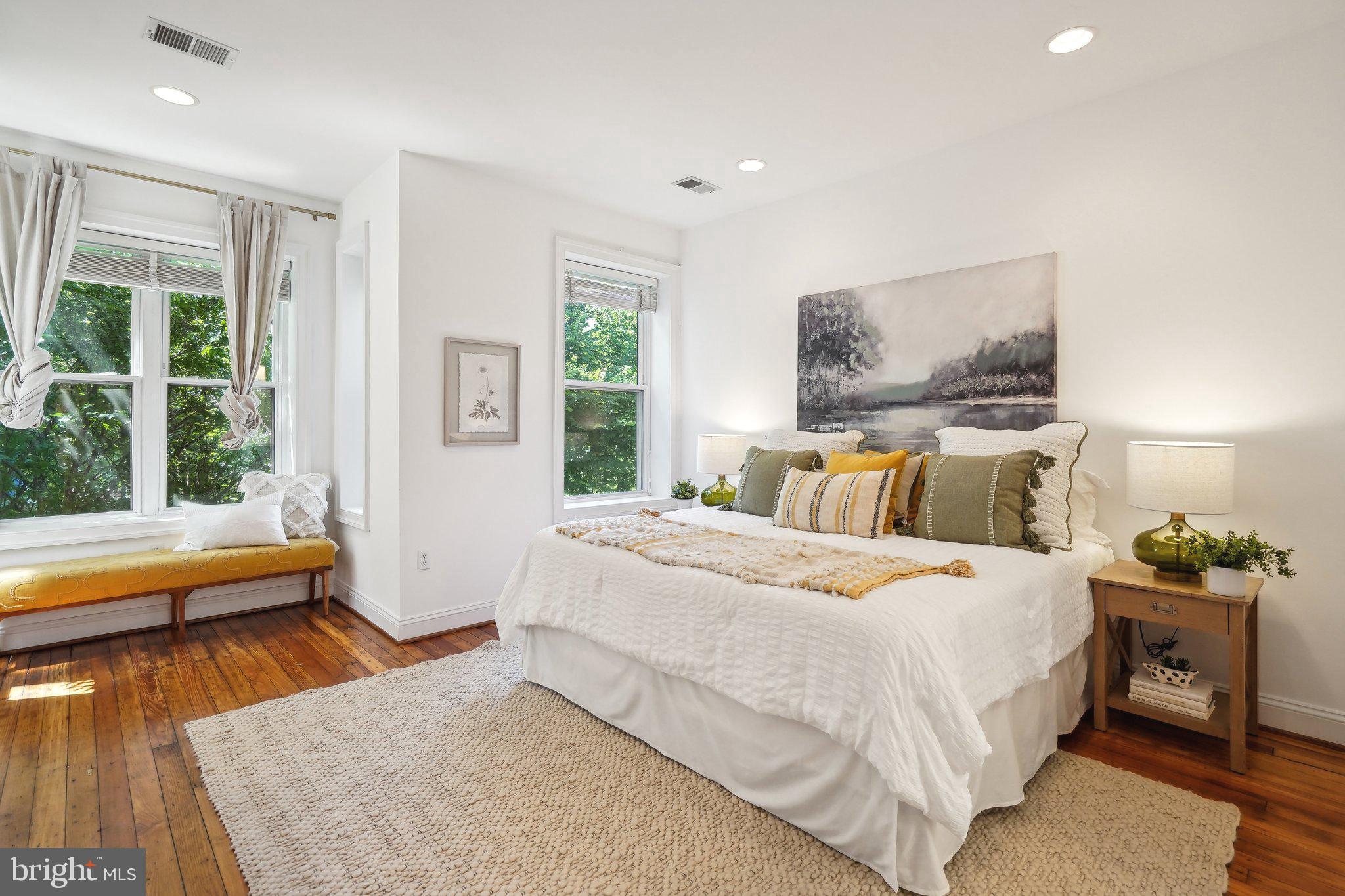 77 U Street Northwest Washington, DC 20001 - Photo 17 of 34 a bedroom with a bed and wooden floor
