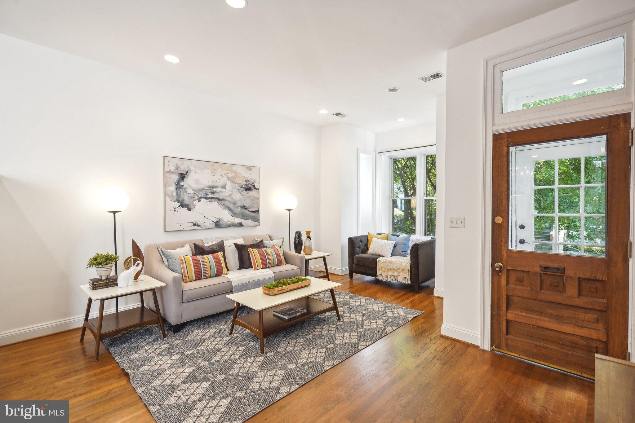 77 U Street Northwest Washington, DC 20001 - Photo 3 of 34 a living room with furniture and a rug