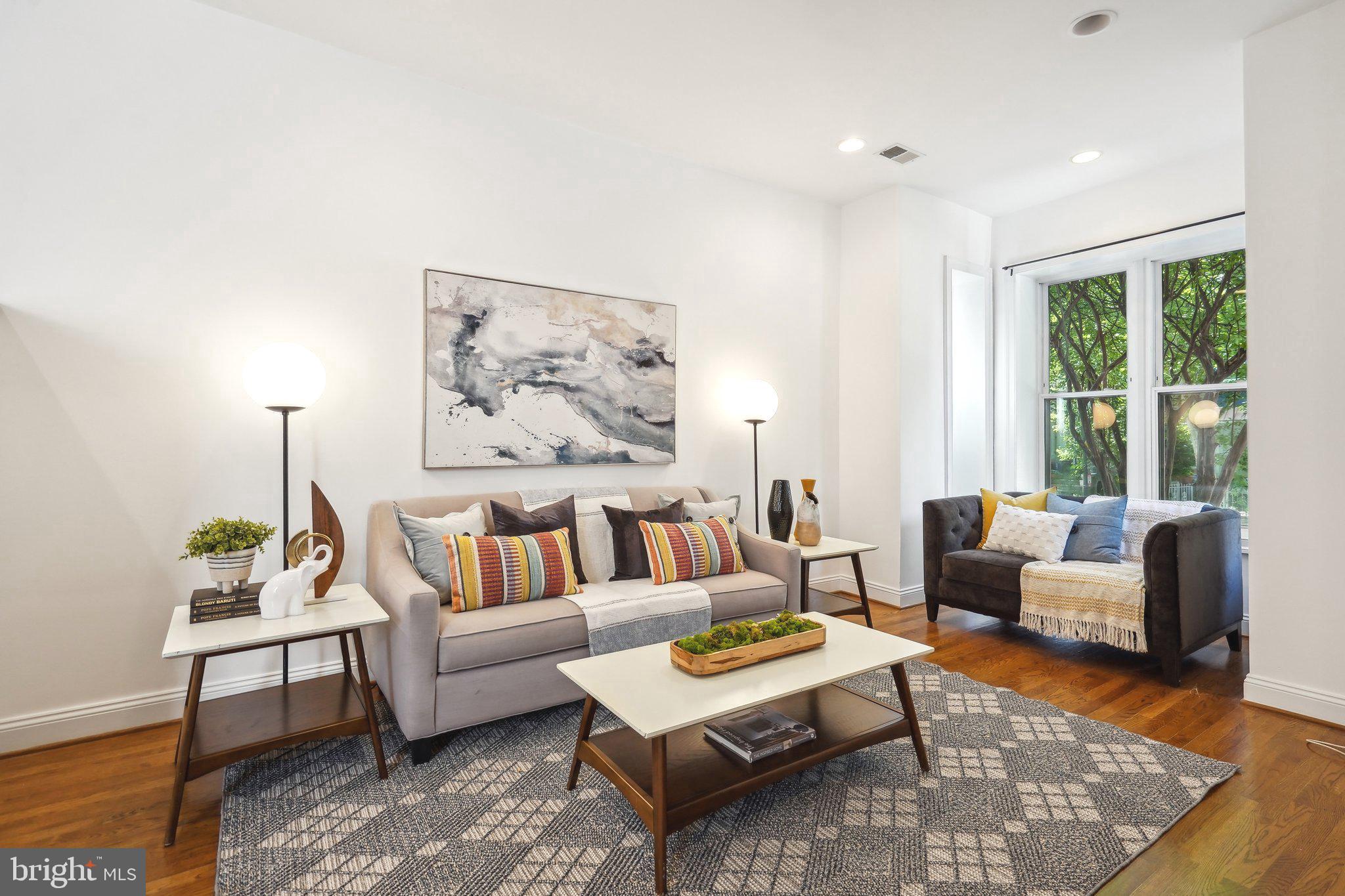 77 U Street Northwest Washington, DC 20001 - Photo 4 of 34 a living room with furniture and a rug