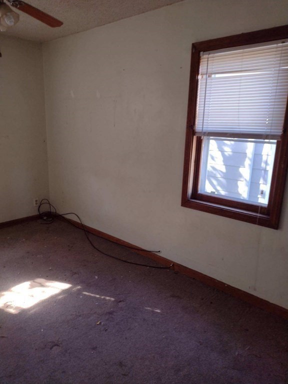 54 Bay Street Fall River, MA 02721 - Photo 5 of 16 a view of empty room with window