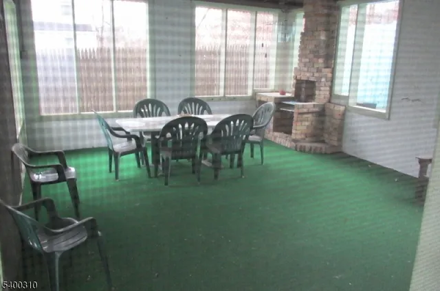 a view of an outdoor sitting area with furniture