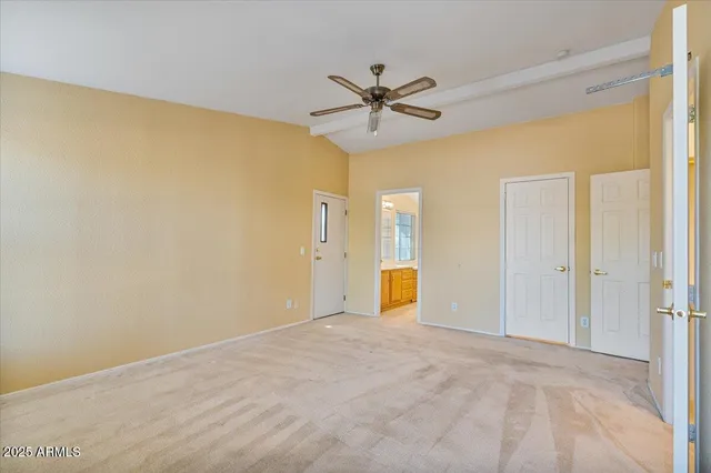 a view of room with wooden floor and closet