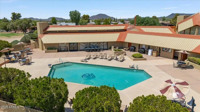 a view of a swimming pool with a patio