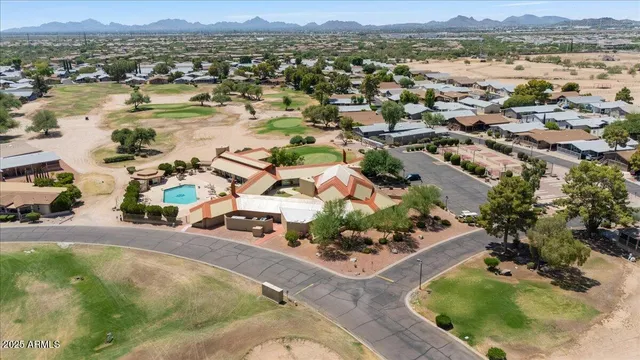 an aerial view of residential houses with outdoor space and river