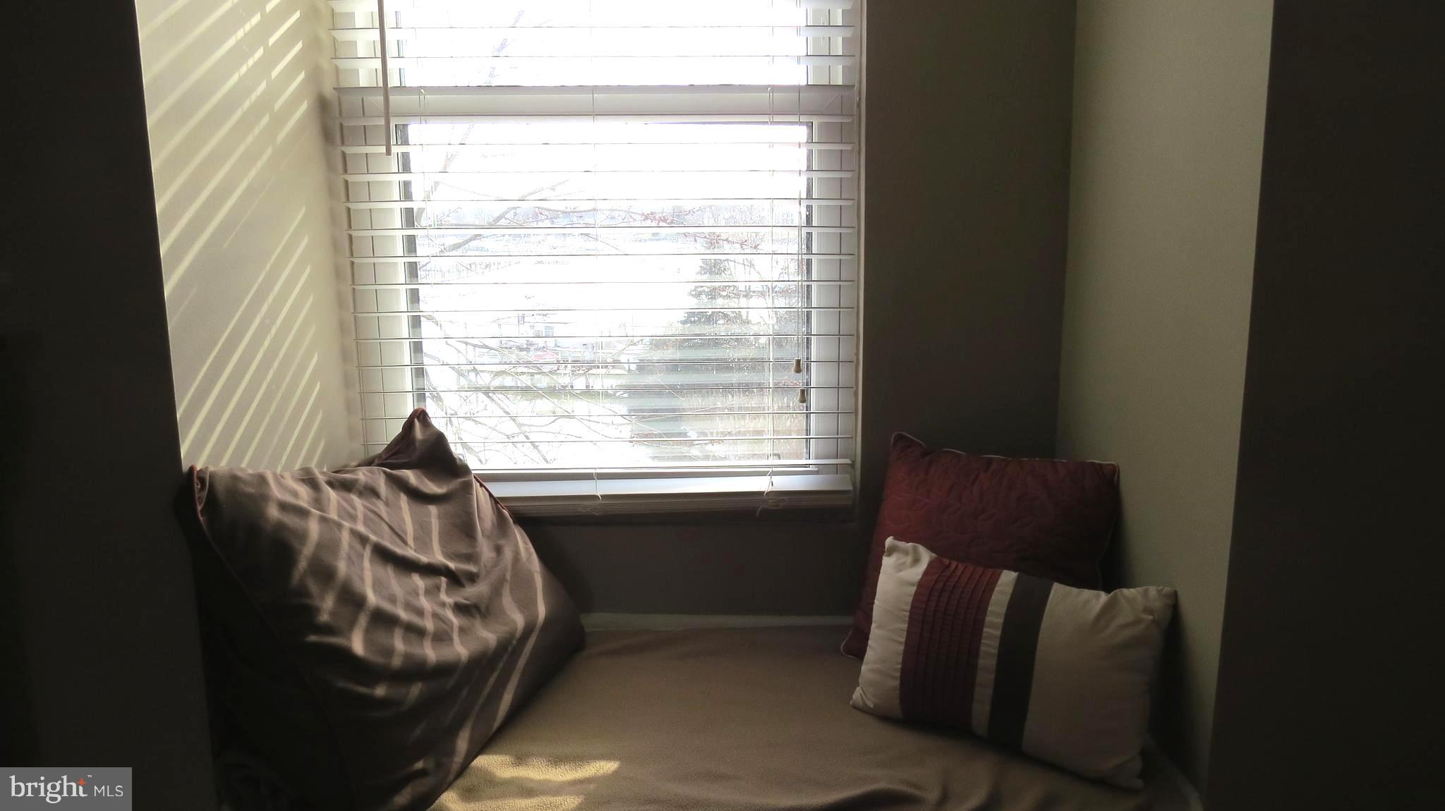 64 Helmsman Court Baltimore, MD 21221 - Photo 13 of 30 Cozy window seat with view of water