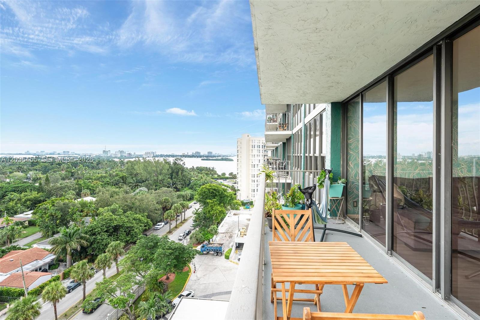 780 Northeast 69th Street, Unit 1010 Miami, FL 33138 - Photo 20 of 31 a view of a balcony with couch