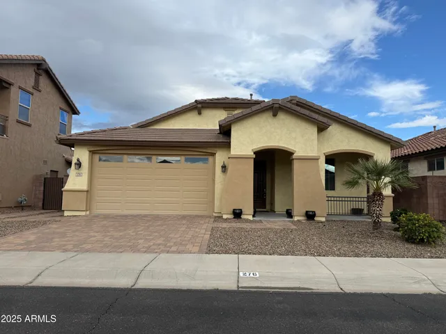 a front view of a house with a garage