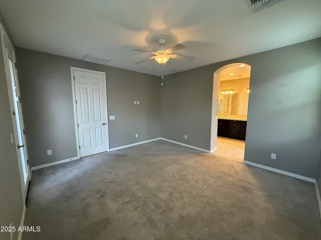 a spacious bathroom with a double vanity sink and a mirror