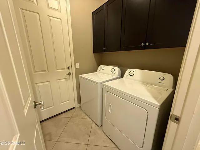 an empty room with windows and entrance