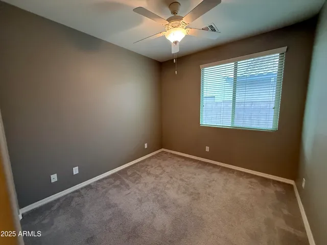 a bathroom with a double vanity sink toilet and shower