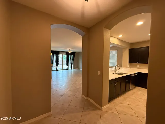 a kitchen with stainless steel appliances a sink and a stove