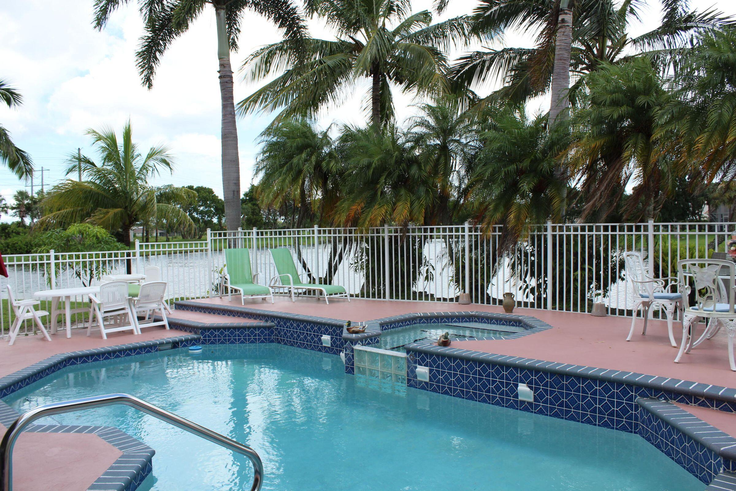 a view of a swimming pool with a lounge chair