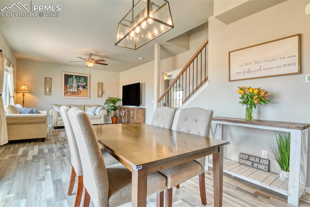 Undisclosed Address Peyton, CO 80831 - Photo 13 of 50 a view of a dining room with furniture and wooden floor