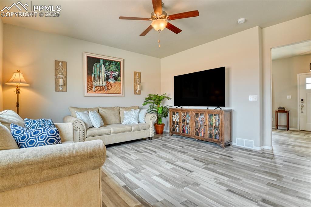 Undisclosed Address Peyton, CO 80831 - Photo 14 of 50 a living room with furniture and a flat screen tv