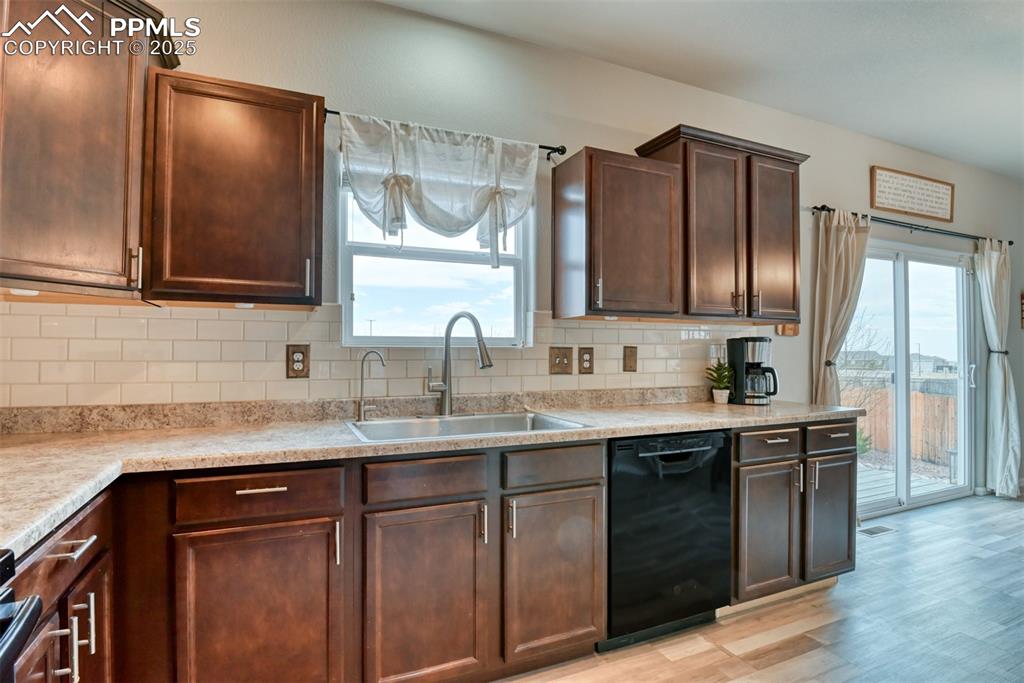 Undisclosed Address Peyton, CO 80831 - Photo 18 of 50 a kitchen with stainless steel appliances granite countertop a sink stove and refrigerator
