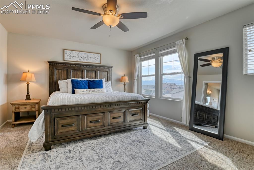 Undisclosed Address Peyton, CO 80831 - Photo 28 of 50 a spacious bedroom with a bed and a mirror