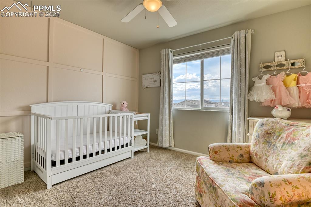 Undisclosed Address Peyton, CO 80831 - Photo 30 of 50 a bed room with a bed and a chandelier