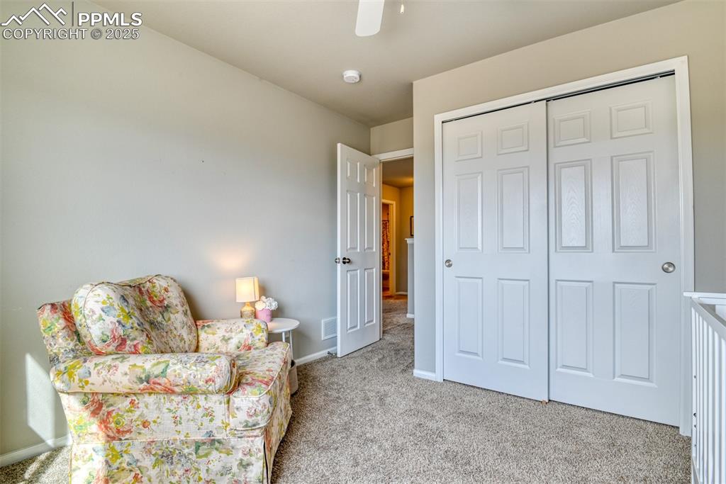 Undisclosed Address Peyton, CO 80831 - Photo 32 of 50 a living room with furniture and a mirror
