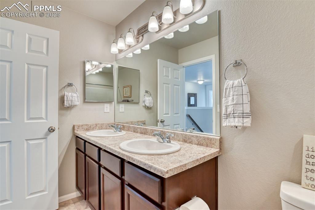 Undisclosed Address Peyton, CO 80831 - Photo 33 of 50 a bathroom with a sink vanity and a mirror
