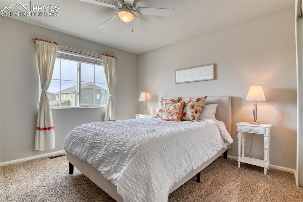 Undisclosed Address Peyton, CO 80831 - Photo 34 of 50 a bedroom with a bed lamp and window