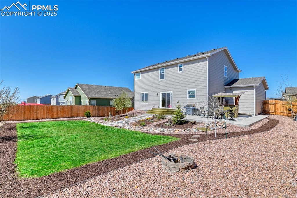Undisclosed Address Peyton, CO 80831 - Photo 42 of 50 a view of a house with backyard and sitting area