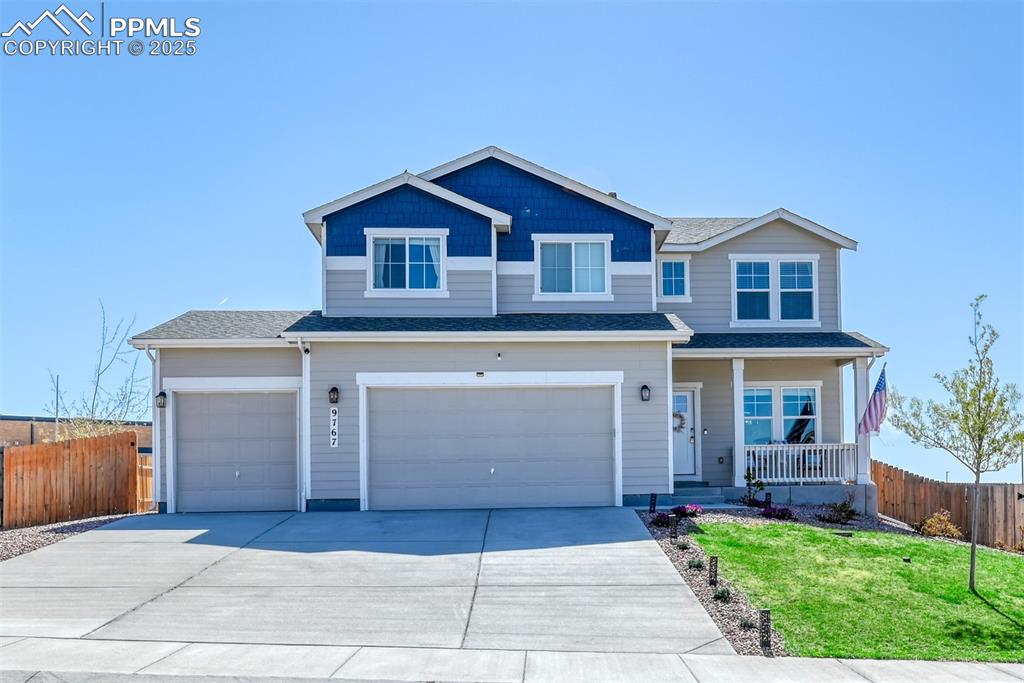 Undisclosed Address Peyton, CO 80831 - Photo 47 of 50 a front view of a house with a yard and garage