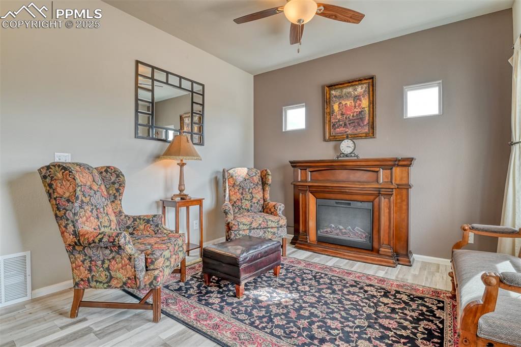 Undisclosed Address Peyton, CO 80831 - Photo 7 of 50 a living room with furniture and a fireplace
