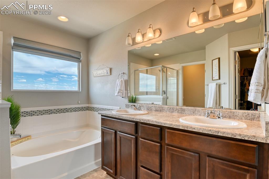 Undisclosed Address Peyton, CO 80831 - Photo 8 of 50 a bathroom with a granite countertop sink mirror bathtub and double