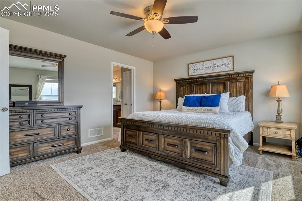 Undisclosed Address Peyton, CO 80831 - Photo 9 of 50 a bedroom with a bed and a chandelier