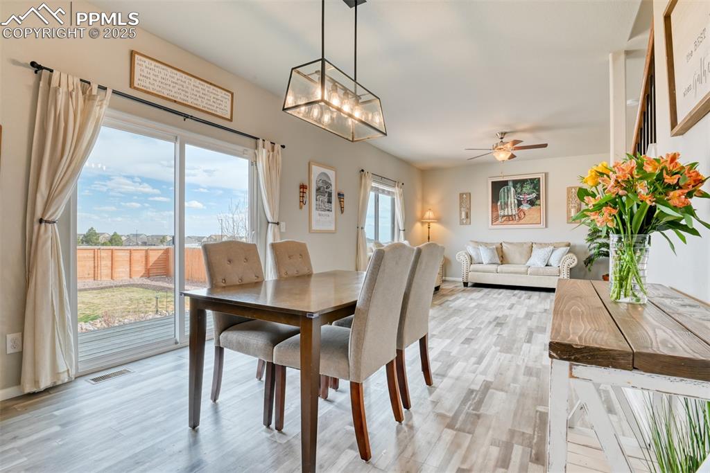 Undisclosed Address Peyton, CO 80831 - Photo 10 of 50 a view of a dining room with furniture window and wooden floor