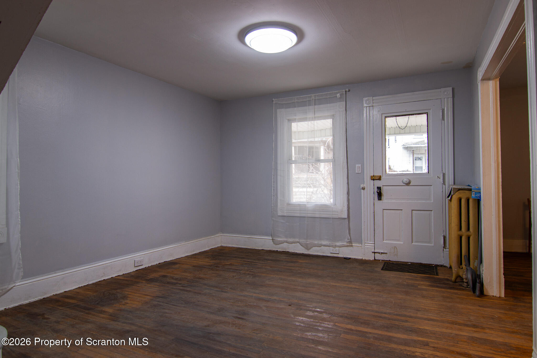 214 William Street Scranton, PA 18508 - Photo 17 of 33 an empty room with wooden floor and windows